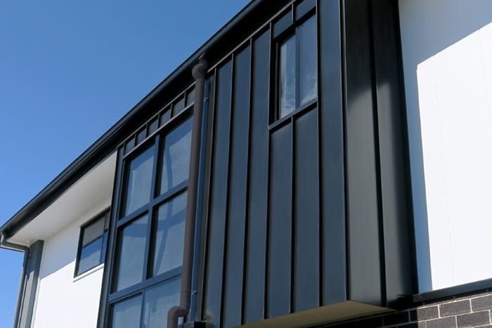 Sliding Window on black color metal steel wall of luxurious house