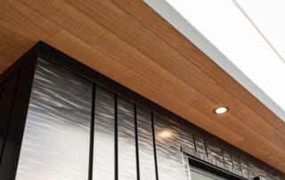 Brown Color roofing with the lighting bulb and grey color design texture of the wall