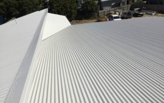 corrugated metal roof with parallel ridges and grooves